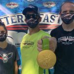 Katie Meili, David Arluck and Will Pisani take a photo together at a Fitter and Faster Swim Camp in Potomac, Maryland during the summer of 2020 with Katie's Olympic Gold Medal